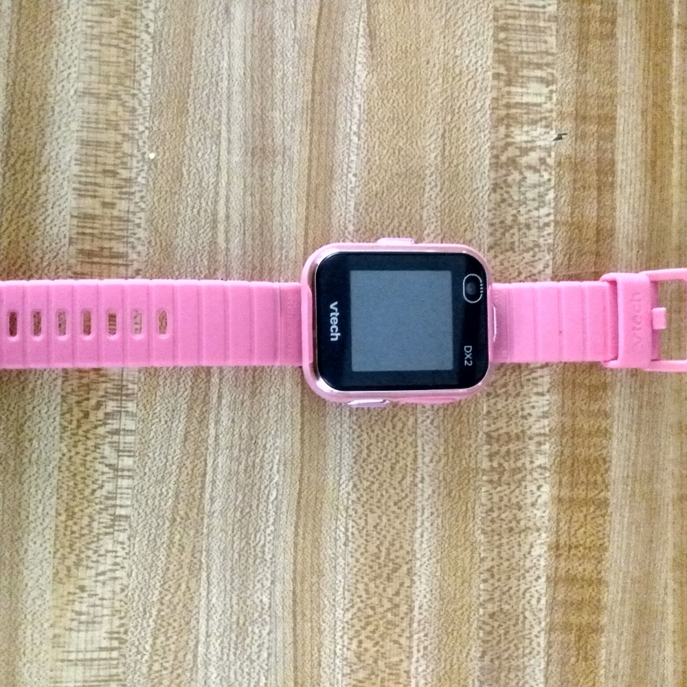V-tech smart watch with USB cord.